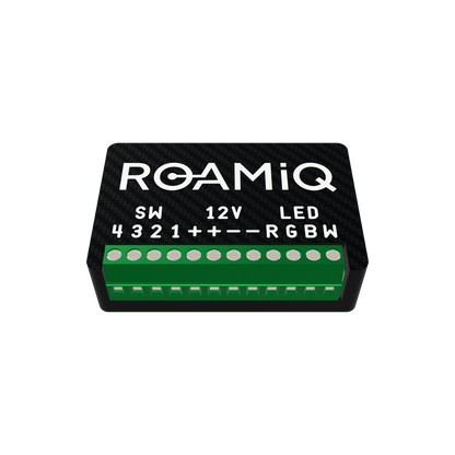 ROAMiQ RGBW Dimmer in its black carbon-pattern case